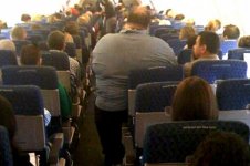 obese-man-on-plane-630-620x413.jpg
